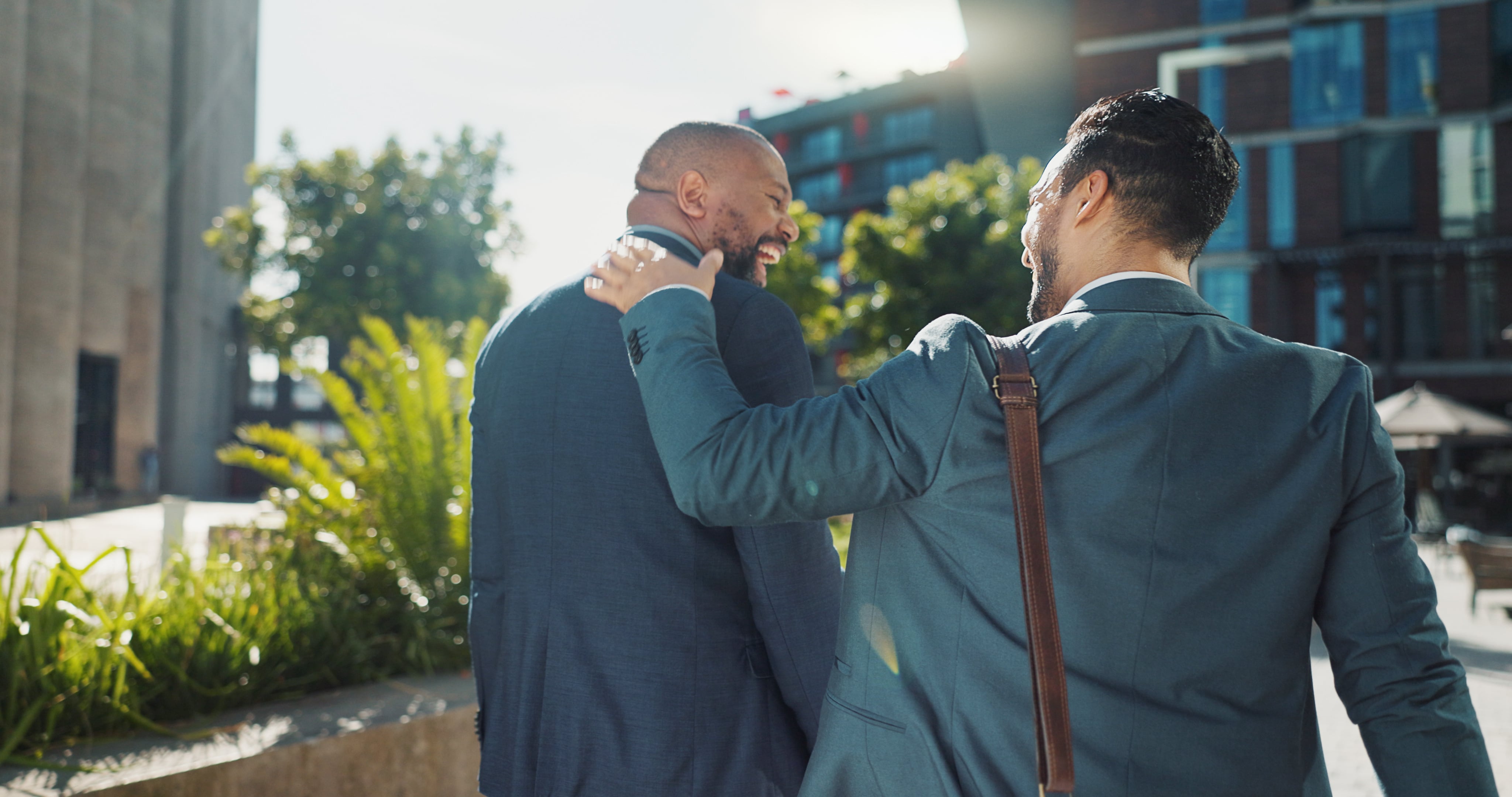 City, Funny and Walking with Business Men Outdoor Together on Morning Commute to Corporate Job. Collaboration, Travel or Back with Mentor and Employee Laughing on Sidewalk or Street of Urban Town